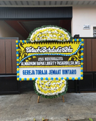 Papan Bunga Duka di Monggol